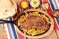 roast beef with seasonings and sliced Ã¢â¬â¹Ã¢â¬â¹barbecue salad served on plate on wooden table Royalty Free Stock Photo